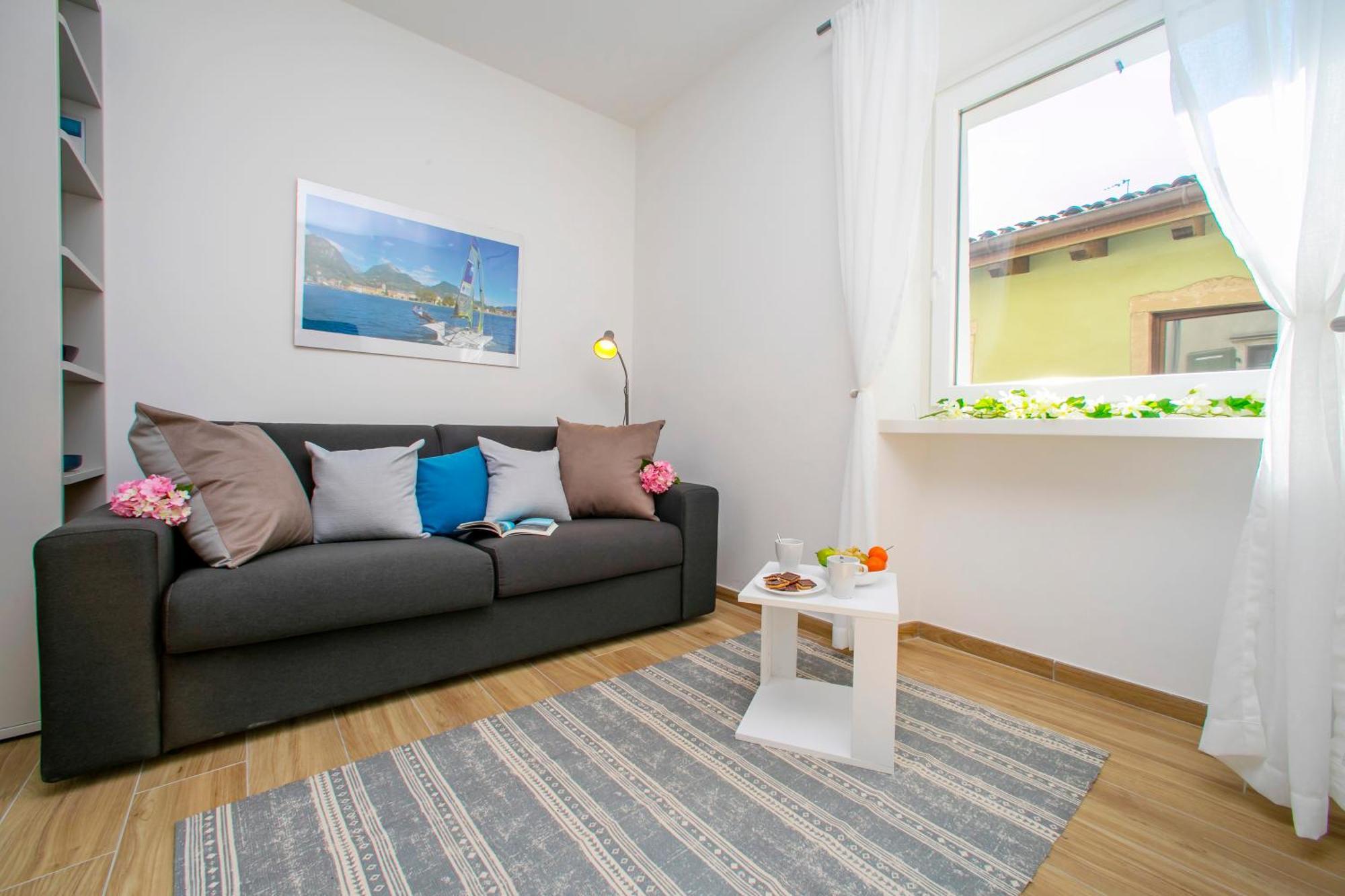 Nido Sui Tetti Di Riva Del Garda - Happy Rentals エクステリア 写真