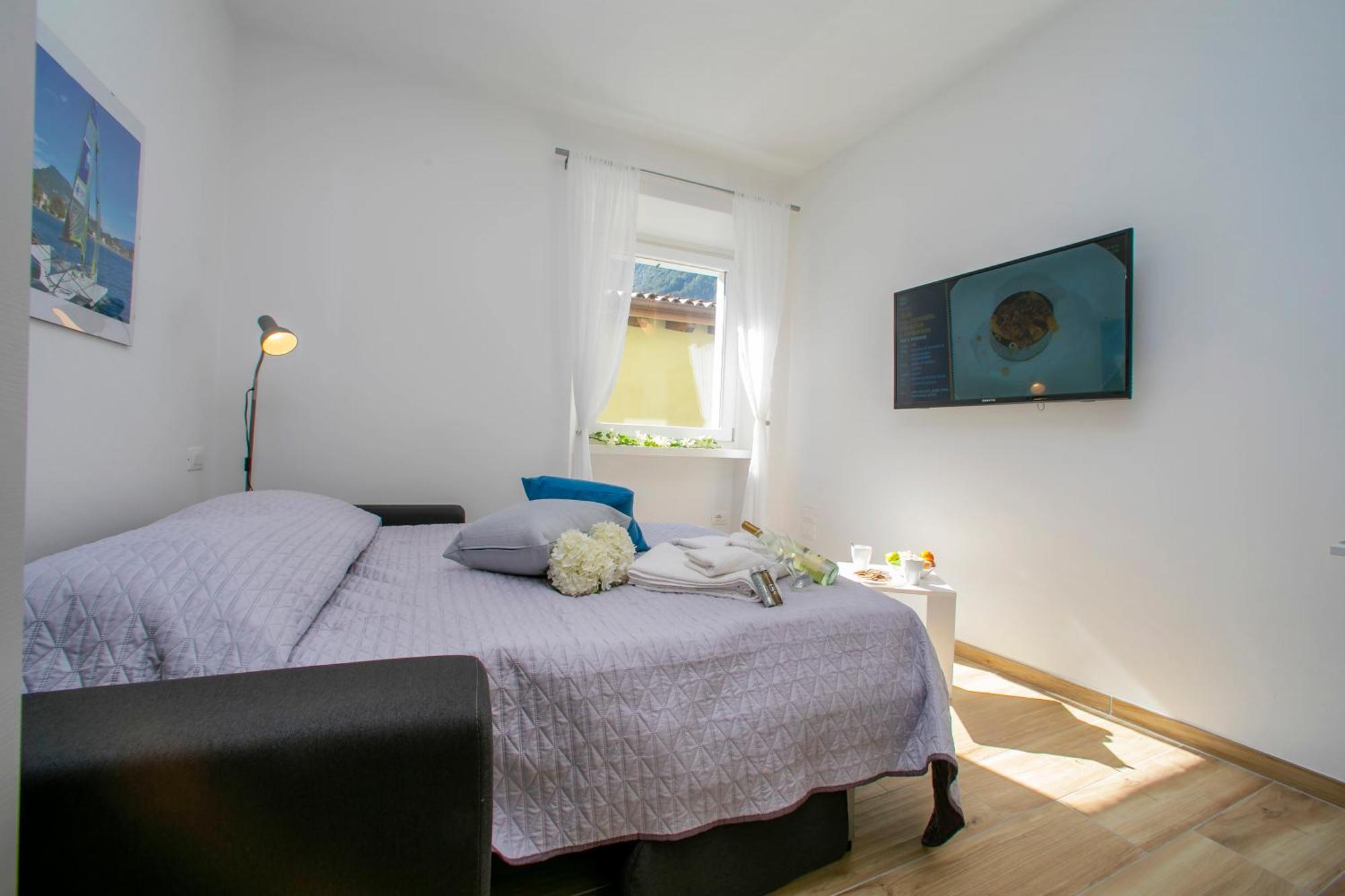 Nido Sui Tetti Di Riva Del Garda - Happy Rentals エクステリア 写真