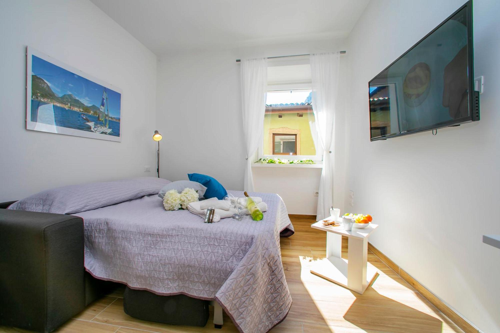 Nido Sui Tetti Di Riva Del Garda - Happy Rentals エクステリア 写真